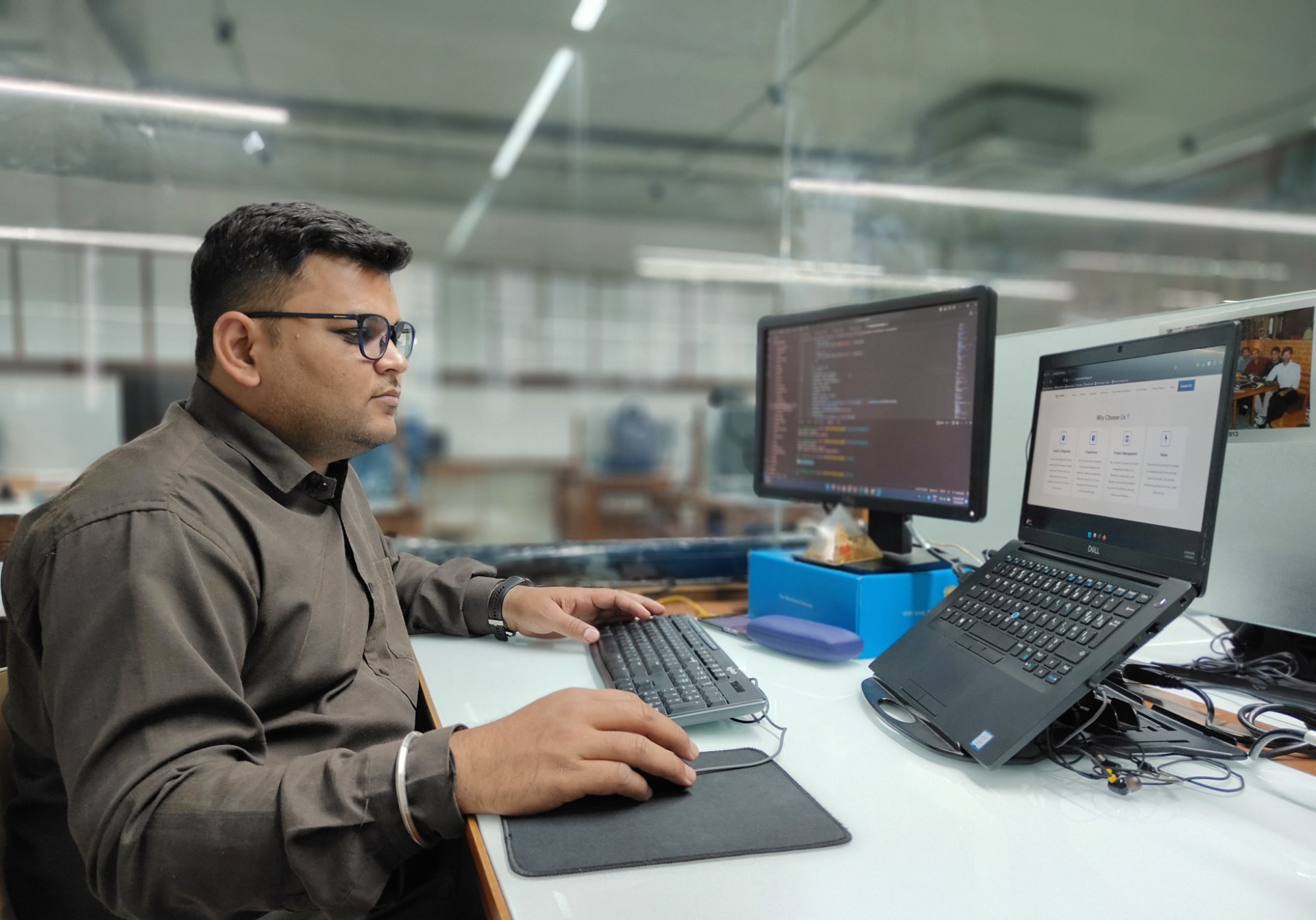 Hasmukh Barochiya, our featured engineer, sitting at his desk working diligently.